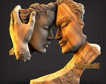 May include: A sculpture of two faces in profile, touching noses. One face is being held by a hand. The sculpture is made of a light-colored material, possibly wood or stone, with a textured surface. The sculpture is on a dark background.
