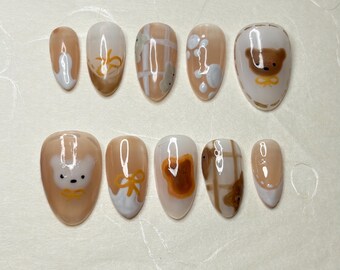 custom press on nails , cute bear inspired hand painted bears and toast picnic nails with bows.