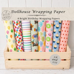 May include: Eight rolls of dollhouse wrapping paper in a wooden crate. Patterns include balloons, colorful confetti, horizontal stripes, dachshunds with balloons, teardrop shapes, donuts, cupcakes, and red stars. Text reads Dollhouse Wrapping Paper.