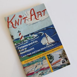 May include: A book titled "Knit Art" with a colorful cover featuring a sailboat, a lighthouse, and a house. The book advertises patterns and kits for knit, needlepoint, latch-hook, and cross stitch projects. It is advertised in McCall's and Good Housekeeping.