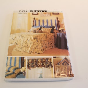 Puede incluir: Un patrón de costura para una cama con estampado floral y cabecero a rayas azul y blanco. El patrón también incluye instrucciones para hacer un faldón y almohadas.