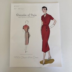 May include: A vintage sewing pattern for a 1950s dress, called "Object d'Art Dress". The pattern is for a red dress with a fitted bodice and a full skirt. The pattern is from the "Decades of Style Pattern Company" and is for a bust size of 30 to 46 inches.