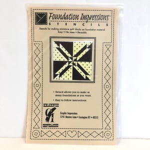May include: Foundation Impressions stencil for making miniature quilt blocks. The stencil features a black and white design with yellow polka dots. The text on the package reads "Foundation Impressions Stencils" and "Easy No mess Reusable".