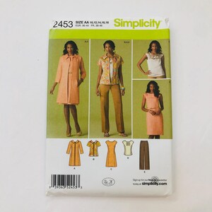 May include: Simplicity sewing pattern number 2453 for sizes 10-18. The pattern includes instructions for making a dress, jacket, pants, and top. The pattern is for women's clothing.