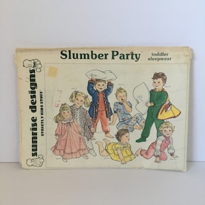 May include: A vintage sewing pattern for children's pajamas. The pattern is called "Slumber Party" and features illustrations of children in pajamas holding pillows. The pattern is for toddler sleepwear.