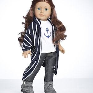 May include: A doll wearing a white shirt with a blue anchor, blue and white striped cardigan, blue jeans, and gray boots.