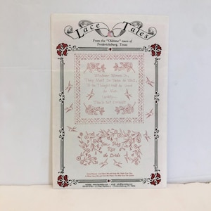May include: A vintage-style printed card with a pink and white floral design. The card features the text "Lace Tales" and "Whatever Women Do, They Must Do Twice As Well, To Be Thought Half As Good As Men. Luckily... This Is Not Difficult." The card also features a smaller floral design with the text "You May Kiss the Bride".