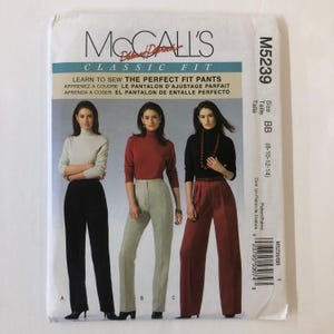 May include: McCall's pattern M5239 for classic fit trousers. The pattern includes instructions for sewing three different styles of trousers: black, beige, and red. The pattern is for sizes 8-10-12-14.