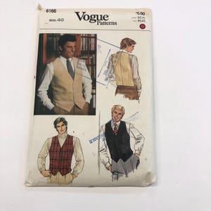 May include: Vogue Patterns sewing pattern envelope featuring illustrations of vests. The envelope is off-white with the number 8166 and the size 40 printed on it. The price is $5.00. The illustrations show different vest styles.