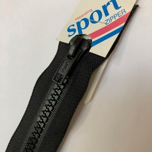 May include: A black separating zipper with a black metal slider. The zipper is labeled "sport zipper" and "28 in 71 cm".