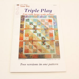 May include: Quilt pattern booklet with a colorful quilt design featuring a variety of floral prints. The title of the pattern is "Triple Play" and the text says "Fun with large scale prints!" and "Two versions in one pattern".