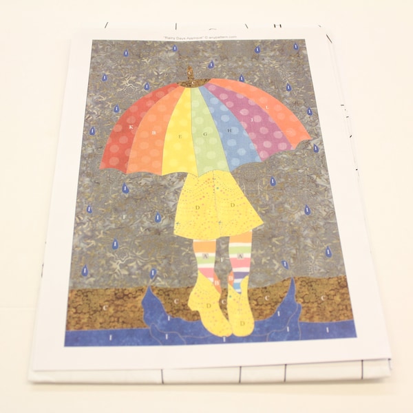 Rainy Days Applique Quilt pattern, Girl under and umbrella quilt pattern by anypattern.com, 22" x 31" applique pattern, umbrella quilt