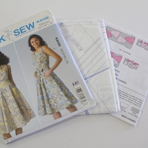Kwik Sew K4098 Fit and Flare sleeveless dress Sewing Pattern. Kwik Sew Dress Pattern, sizes XS-XL Bust 31 1/2&quot;-45&quot;, dress and sash pattern