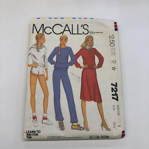May include: Vintage McCall's sewing pattern with illustrations of athletic wear and a dress. The pattern includes a hoodie and shorts set, a tracksuit, and a red dress. The pattern is for Miss size 8, with a bust size of 80 cm.