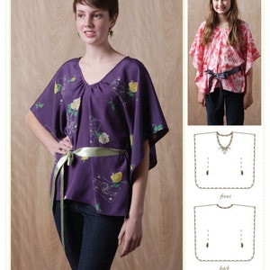 May include: A sewing pattern for a purple butterfly blouse with a green sash. The pattern includes instructions for sizes ranging from kids' small to adult large. The pattern is called "Maya Butterfly Blouse" and is by Bonjour Teaspoon.