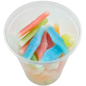 May include: A clear plastic cup filled with colorful candy shaped like bottles. The candy is in shades of blue, green, pink, and yellow.