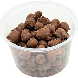 May include: A clear plastic container filled with chocolate covered peanuts. The peanuts are round and have a smooth, shiny chocolate coating.