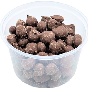 May include: A clear plastic container filled with dark chocolate peanut butter cups.