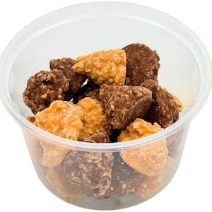 May include: A clear plastic container filled with a mixture of chocolate and caramel candies. The candies are shaped like cones and are a light brown and dark brown color.