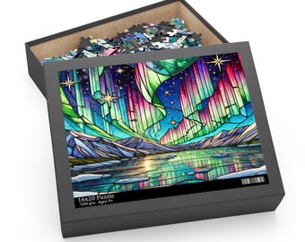 May include: A 500 piece jigsaw puzzle featuring a stained glass style image of the Northern Lights reflected in a lake. The box is black with the text "16x20 Puzzle 500 pcs Ages 9+"