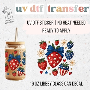 May include: A clear 16 oz Libbey glass can with a wooden lid and straw, decorated with a UV DTF transfer. The design features red strawberries with blue bows, stars, and patriotic patterns. The text "UV DTF transfer" is at the top.