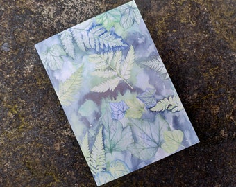 May include: A watercolor painting of leaves and ferns in shades of blue, green, and white on a light blue background.