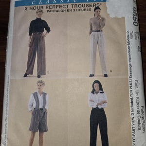 May include: A McCall's sewing pattern for classic fit trousers. The pattern features four different trouser styles, including wide-leg and shorts options. The pattern includes the text "3 Hour Perfect Trousers" and is size 22.