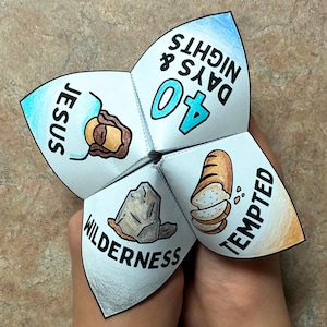 May include: A white paper fortune teller with illustrations and text. The text includes "Jesus", "40 Days & Nights", "Wilderness", and "Tempted". The illustrations depict a loaf of bread, a rock, and a person.