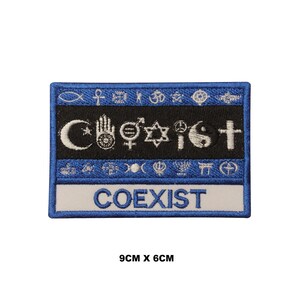 May include: A blue and white embroidered patch with the word "COEXIST" in white lettering. The patch features a variety of religious symbols, including a crescent moon and star, a hand with an eye, a peace sign, a yin yang symbol, and a cross. The patch measures 9 cm by 6 cm.