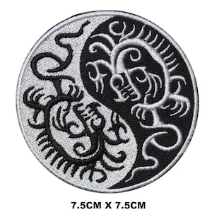 May include: Black and white embroidered yin yang patch with a dragon design. The patch is 7.5 cm in diameter.