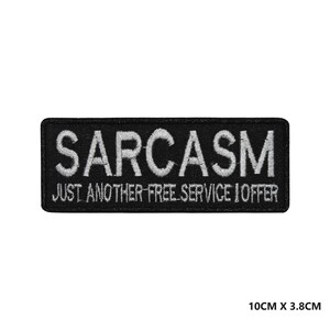 May include: Black embroidered patch with white text that reads "SARCASM JUST ANOTHER FREE SERVICE I OFFER" and measures 10cm by 3.8cm.