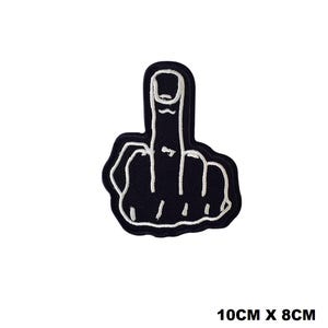 May include: Black embroidered iron-on patch of a middle finger with white stitching. The patch is 10 cm by 8 cm.