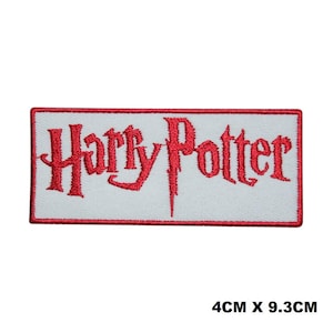 May include: Embroidered patch with the words "Harry Potter" in red script on a white background. The rectangular patch has a red border and measures 4cm x 9.3cm.