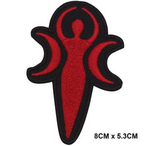May include: Red embroidered iron-on patch of a stylized female figure with three crescent moons, 8 cm by 5.3 cm.