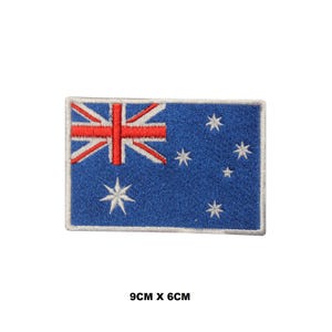 May include: An embroidered Australian flag patch with a blue background, white stars, and a red and white Union Jack in the top left corner. The patch measures 9cm by 6cm.