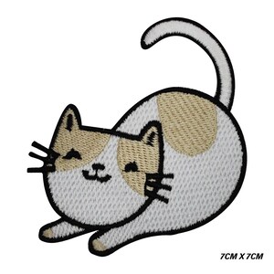 May include: Embroidered patch with a cat design. The cat is white with tan patches and black detailing, including whiskers and a smiling face. The patch measures 7cm x 7cm (approx. 2.75 inches x 2.75 inches).