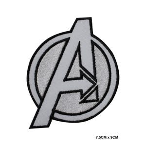 May include: A white and black embroidered iron-on patch featuring the Avengers logo, a stylized "A" inside a circle. The patch measures 7.5 cm by 9 cm.