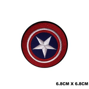 May include: An embroidered patch featuring a white star on a blue circle surrounded by a white circle and a red circle. The patch is 6.8 cm by 6.8 cm.
