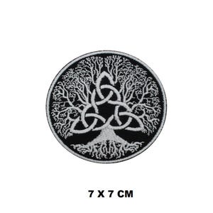 May include: A circular black patch with a white Tree of Life design. The tree's branches and roots are detailed, with a central Celtic knot. The patch measures 7 x 7 cm, approximately 2.75 x 2.75 inches.