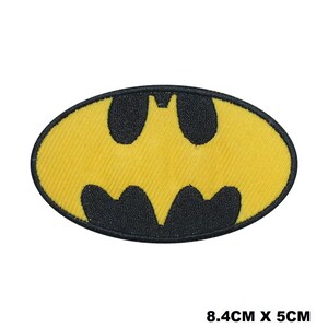 May include: Yellow and black embroidered iron-on patch of the Batman logo. The logo is 8.4 cm by 5 cm.