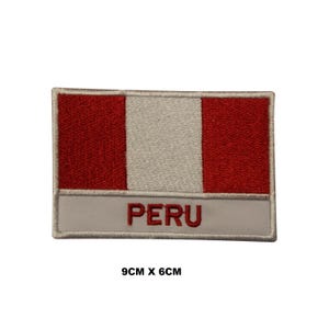 May include: Embroidered patch featuring the flag of Peru. The rectangular patch has a white central stripe flanked by red stripes. The word "PERU" is embroidered in red on a white banner at the bottom. The patch measures 9cm x 6cm.
