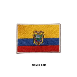 May include: Embroidered patch featuring the flag of Ecuador. The rectangular patch has a yellow upper section, a blue middle section, and a red lower section. The Ecuadorian coat of arms is in the center. The patch measures 9cm x 6cm.