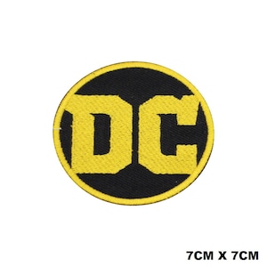 May include: A yellow embroidered DC logo patch on a black background. The patch is circular and measures 7 cm by 7 cm.