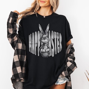 May include: A set of three ceramic mugs with a speckled, matte finish in cream, light grey, and dark grey. Each mug has a simple, minimalist design, suitable for coffee or tea.