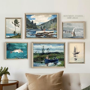 May include: A set of five framed watercolor paintings depicting various scenes of nature, including a palm tree on a beach, a man fishing from a log in a river, a fish jumping out of the water, two men in a boat on a lake, and a sailboat on a lake. The paintings are all in a light wood frame.