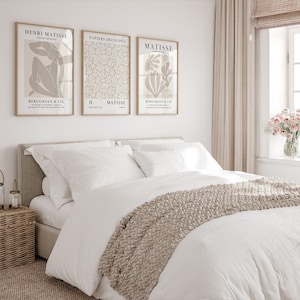 Set of 12 beige Henri Matisse inspired posters featuring abstract botanical shapes, geometric floral forms, and modern cut-out style designs. This neutral boho art collection uses soft beige tones and minimalist lines, making it ideal for a modern gallery wall, or mid-century modern home decor. Elegant abstract flowers and geometric modern art prints create a cohesive, calm aesthetic for living rooms, bedrooms, and stylish interiors.