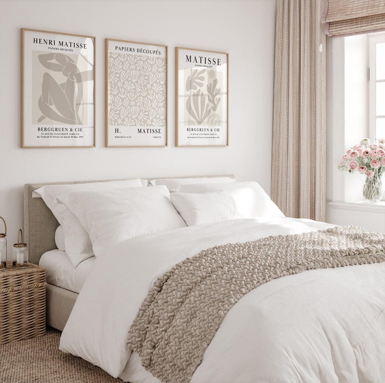Set of 12 beige Henri Matisse inspired posters featuring abstract botanical shapes, geometric floral forms, and modern cut-out style designs. This neutral boho art collection uses soft beige tones and minimalist lines, making it ideal for a modern gallery wall, or mid-century modern home decor. Elegant abstract flowers and geometric modern art prints create a cohesive, calm aesthetic for living rooms, bedrooms, and stylish interiors.