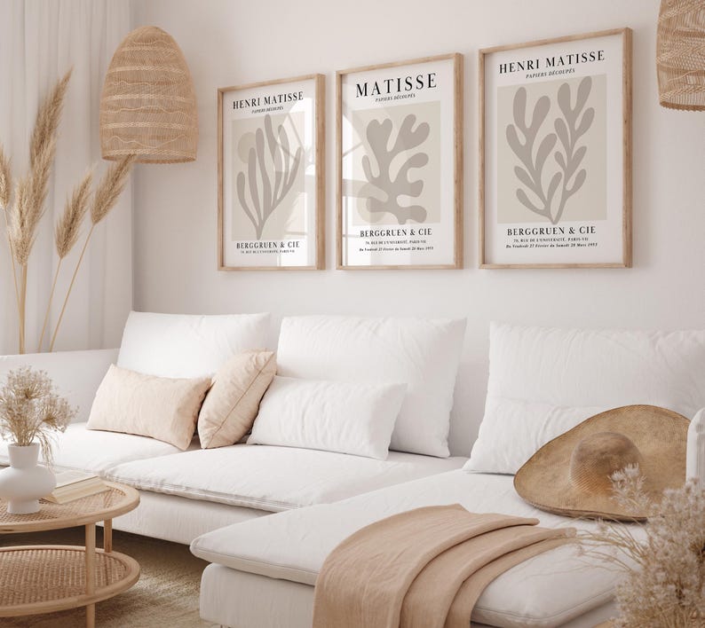 Set of 12 beige Henri Matisse inspired posters featuring abstract botanical shapes, geometric floral forms, and modern cut-out style designs. This neutral boho art collection uses soft beige tones and minimalist lines, making it ideal for a modern gallery wall, or mid-century modern home decor. Elegant abstract flowers and geometric modern art prints create a cohesive, calm aesthetic for living rooms, bedrooms, and stylish interiors.