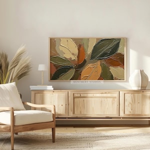 Abstract Fall Leaves TV Art featuring textured painting details in earthy brown and muted green tones. Perfect as seasonal autumn wall decor or Thanksgiving TV art, this boho autumn art creates a warm rustic ambiance for farmhouse living rooms or modern earthy interiors. A unique textured fall painting, ideal as fall frame TV art to bring cozy seasonal charm and natural beauty into your home during the autumn months.