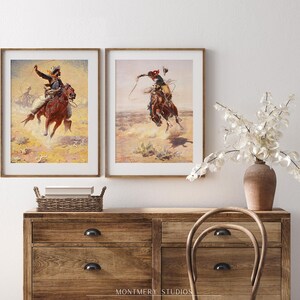 Western cowboy art set of 2 featuring vintage cowboy prints, rustic frontier scenes, and Old West horse riders. Perfect for Western home decor, farmhouse wall art, or Southwestern interiors. Antique cowboy artwork with a nostalgic Wild West feel, ideal for ranch-style homes, cowboy-themed rooms, or rustic lodge decor. Pioneer and frontier-inspired prints capturing the spirit of the American West, blending history, adventure, and classic Western aesthetics.